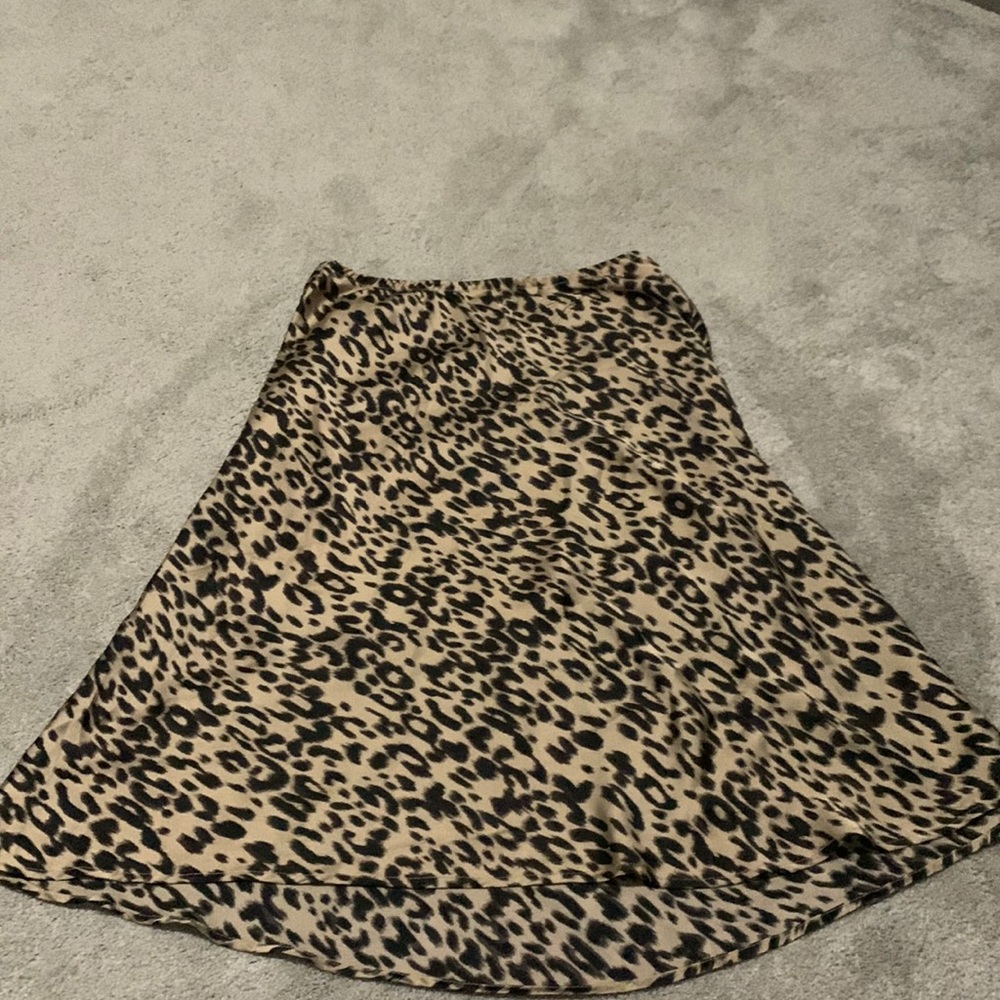 Cheetah print skirt with satin material has an under layer that shorter